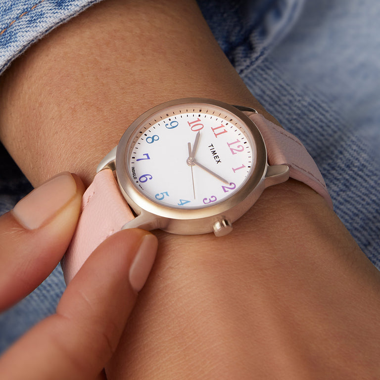 Our newest Easy Reader made with sustainable materials.  The Watch with a pink strap is featured on a woman's wrist