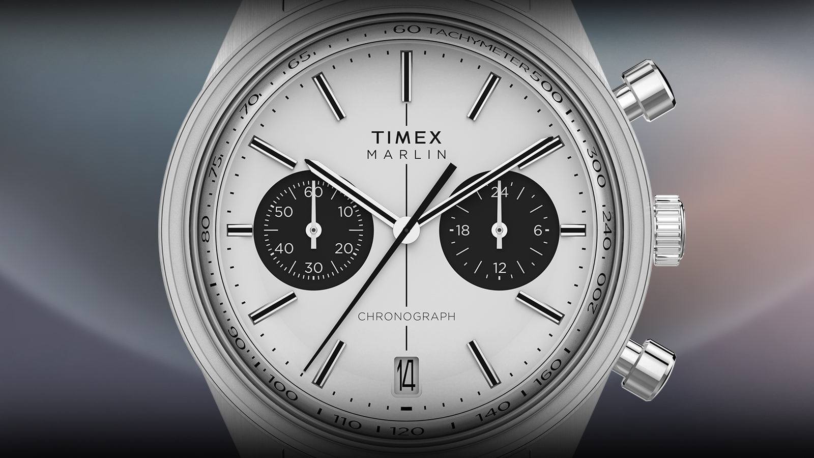 A detailed front-facing render of the Timex Marlin® Jet Chronograph. The crisp white dial features bold black sub-dials for 24-hour and 60-second counters, baton hour markers, a tachymeter ring, and date display at 6 o’clock.