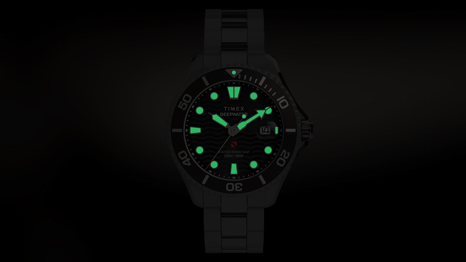 Timex Deepwater Meridian 200 with luminous green indices and hands glowing in darkness.