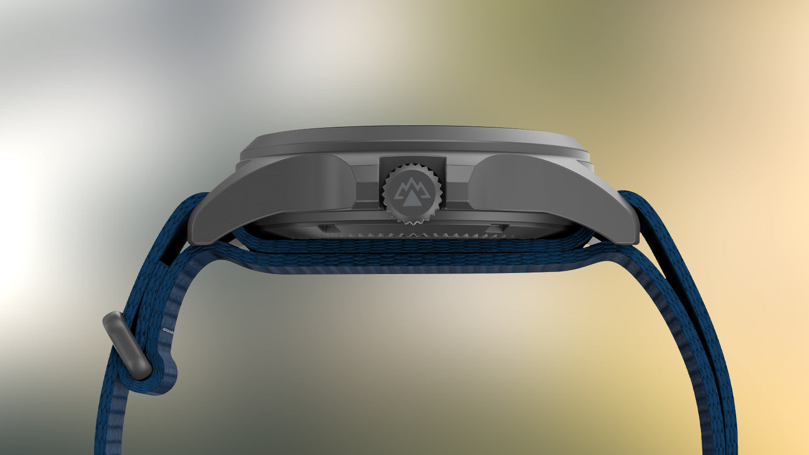 Slim side profile of the Expedition® Field Post Solar with matte stainless steel case, engraved crown with mountain logo, and navy fabric strap.