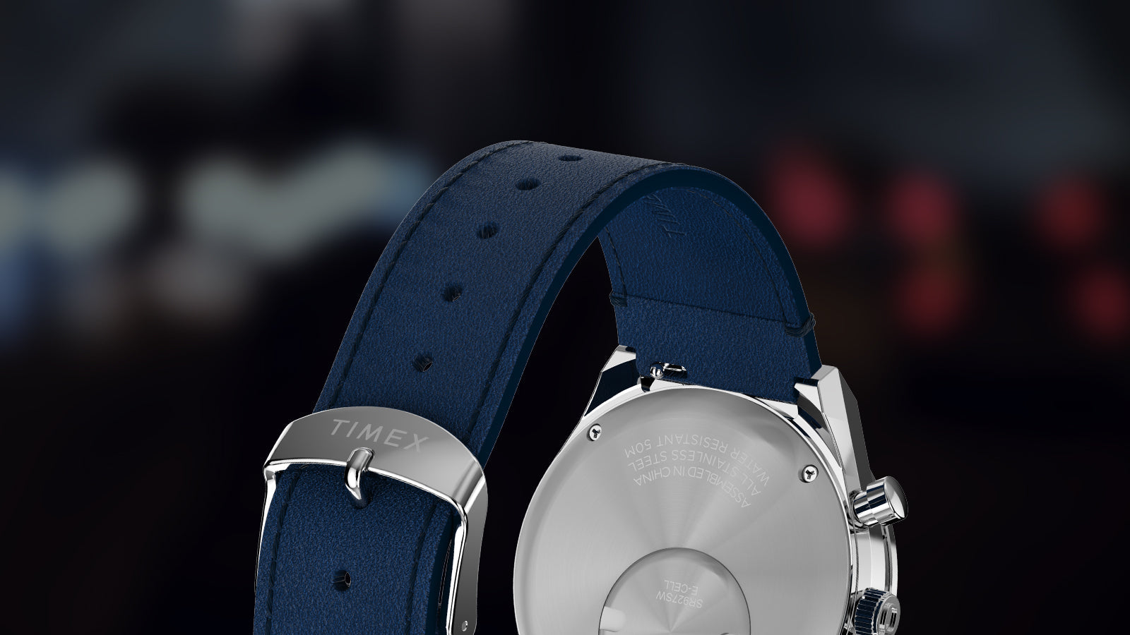 Back view of the Q Timex® Chronograph highlighting the blue leather strap, Timex buckle, and stainless-steel caseback.