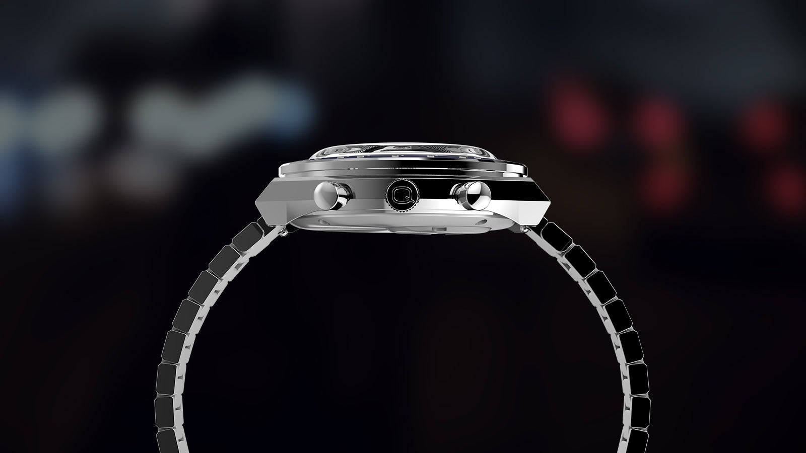Side profile of the Q Timex® Chronograph showing polished case, chronograph pushers, Q-signed crown, and stainless-steel bracelet.
