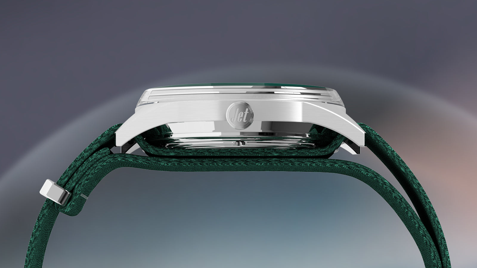 Side profile of the Timex Marlin® Jet Automatic watch showing the polished stainless-steel case engraved with “Jet,” paired with a green woven strap.