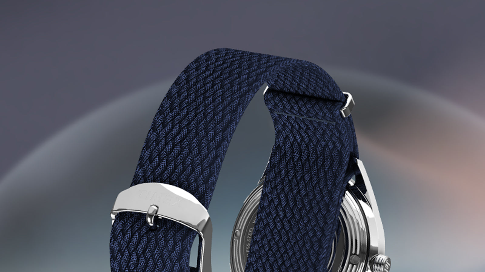 Rear view of the Timex Marlin® Jet Automatic woven navy strap with stainless-steel buckle engraved with “TIMEX.”