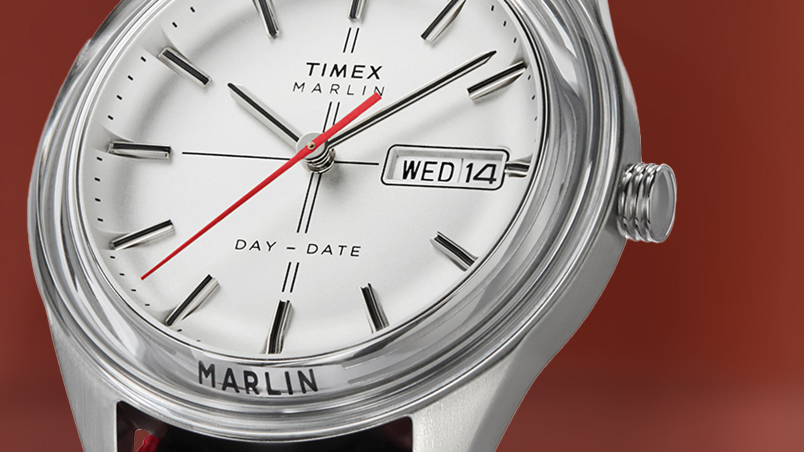 Close-up of the Timex Marlin® Jet Quartz dial, highlighting silver-tone markers, red seconds hand, and day-date window with “WED 14” displayed.
