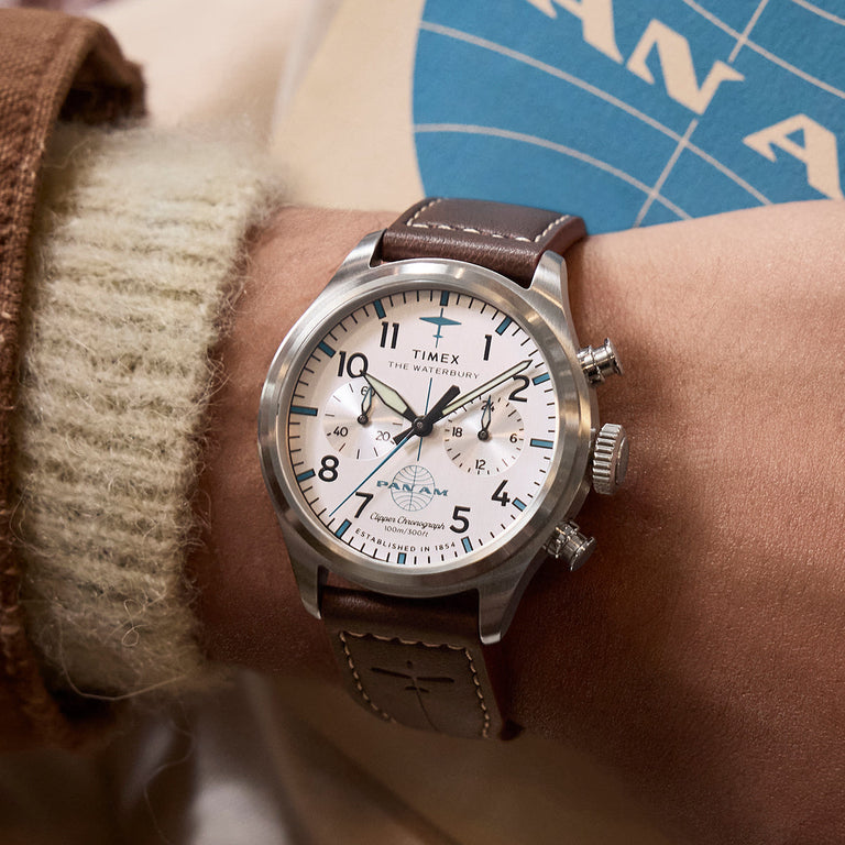 Timex x Pan Am® Waterbury Ace Chronograph on wrist, showing its aviation-inspired chronograph design with bold black numerals and Pan Am logo on the dial.