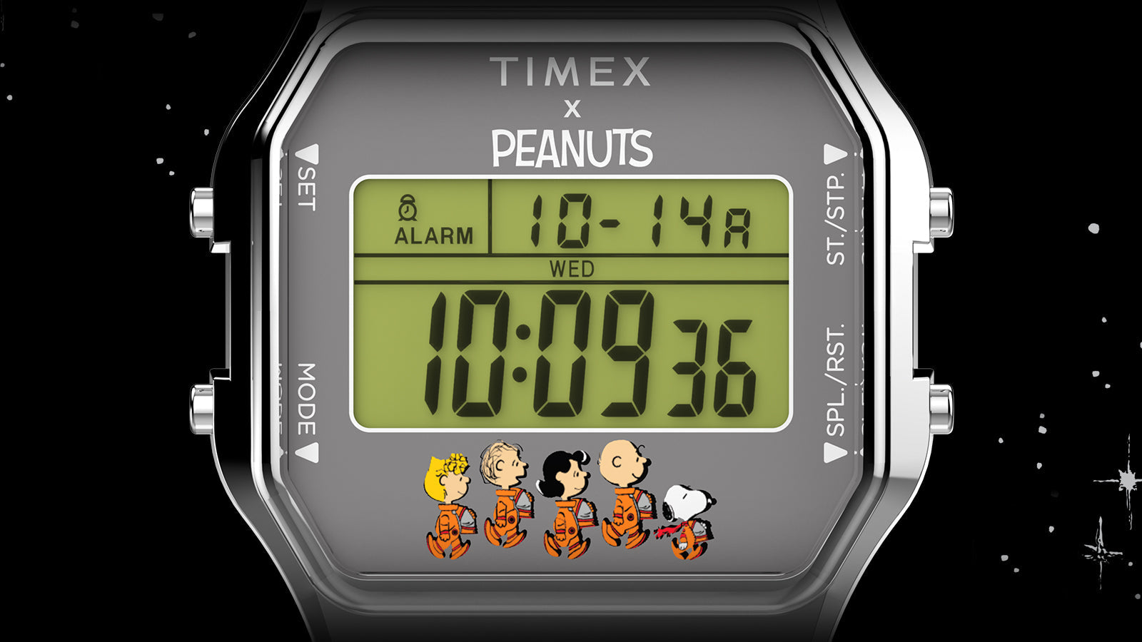 Close-up of the Timex x Peanuts® T80 digital watch face. The screen shows the time and date, with Peanuts characters in space suits walking in a line along the bottom of the digital display.