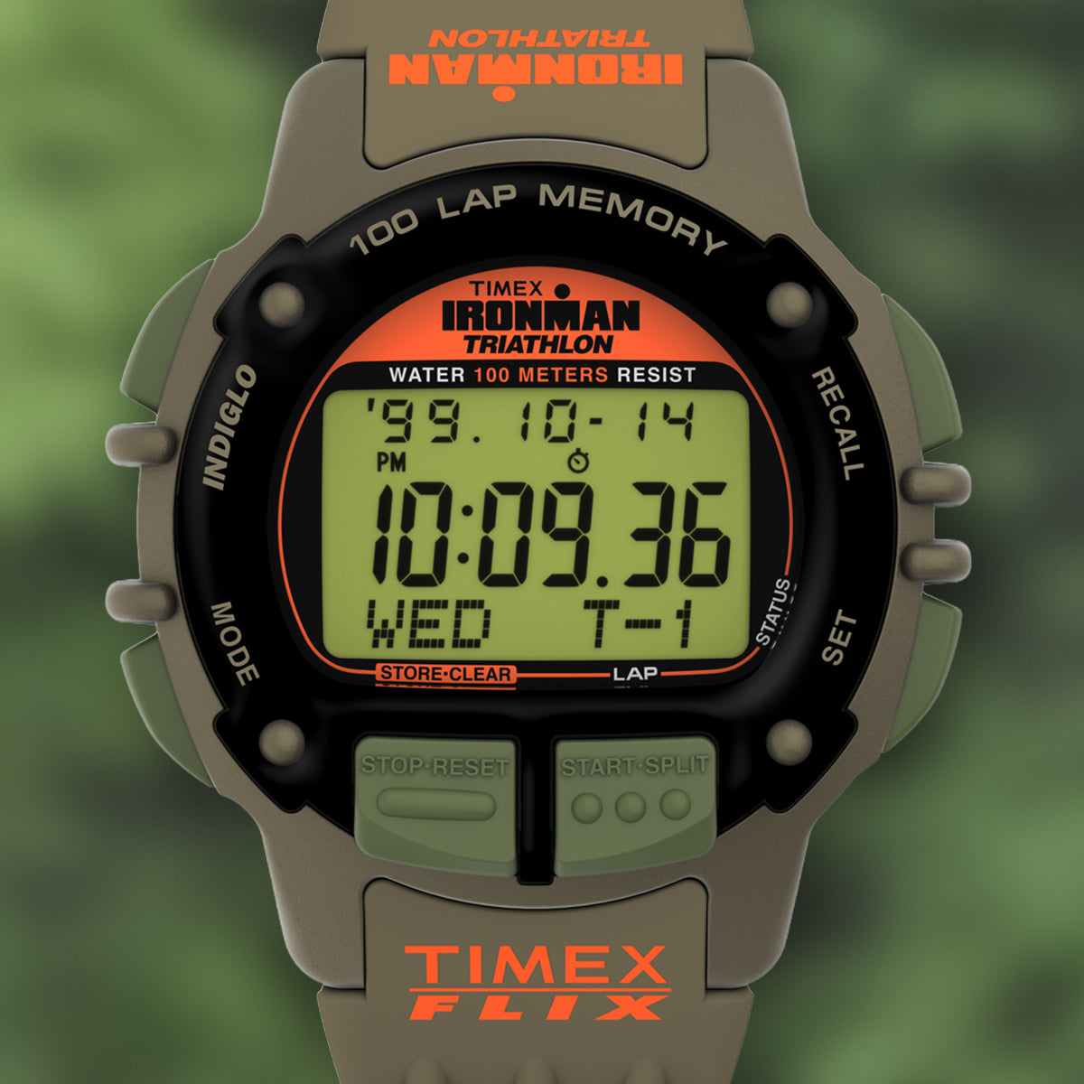 A detailed studio image of the TIMEX® IRONMAN® Flix x Huckberry watch. The screen shows bold black digits with an orange TIMEX FLIX logo on the strap. Features include a 100-lap memory, stopwatch, and water resistance to 100 meters.