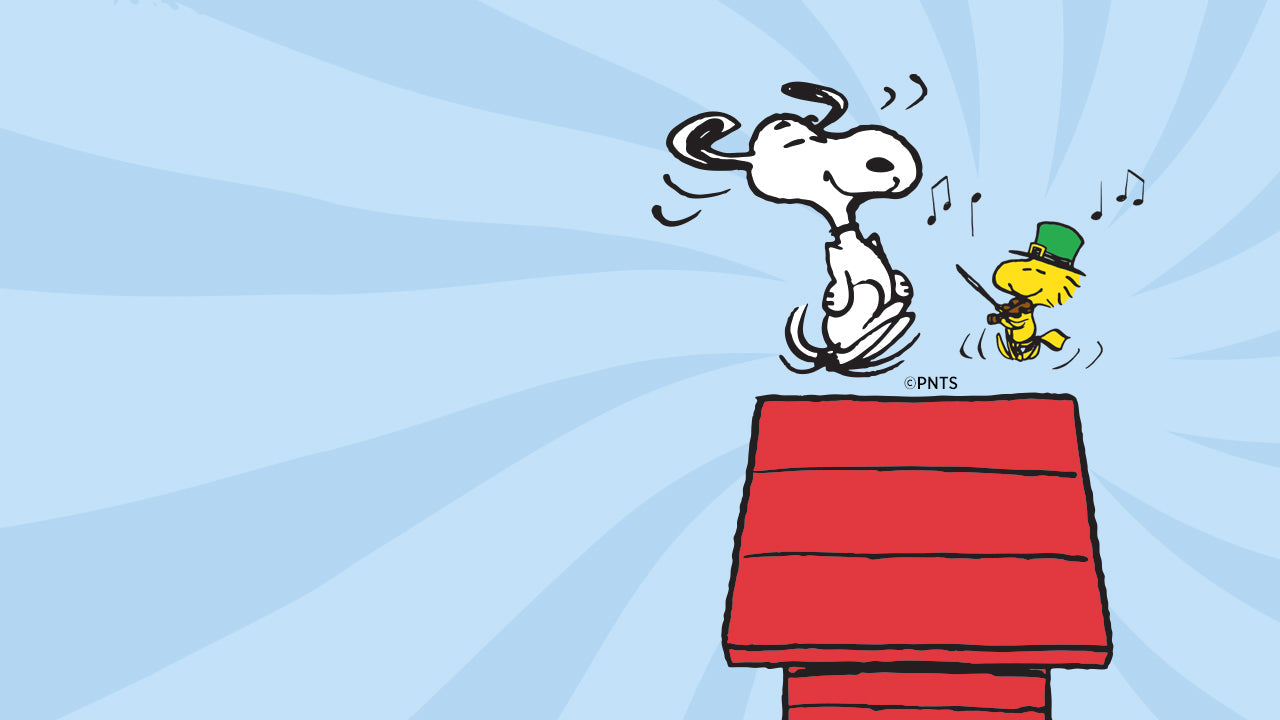Illustration of Snoopy dancing on his red doghouse roof as Woodstock plays the violin nearby. The background is bright blue with musical notes, conveying a joyful, whimsical mood.