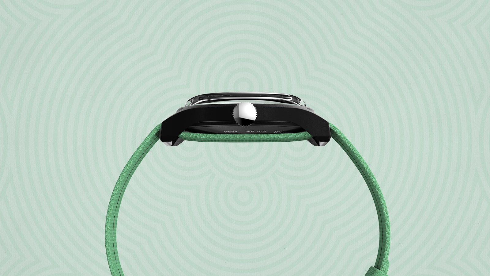 Side profile of the Timex x Monopoly watch displaying the slim chrome case and textured mint-green strap against a light geometric background.