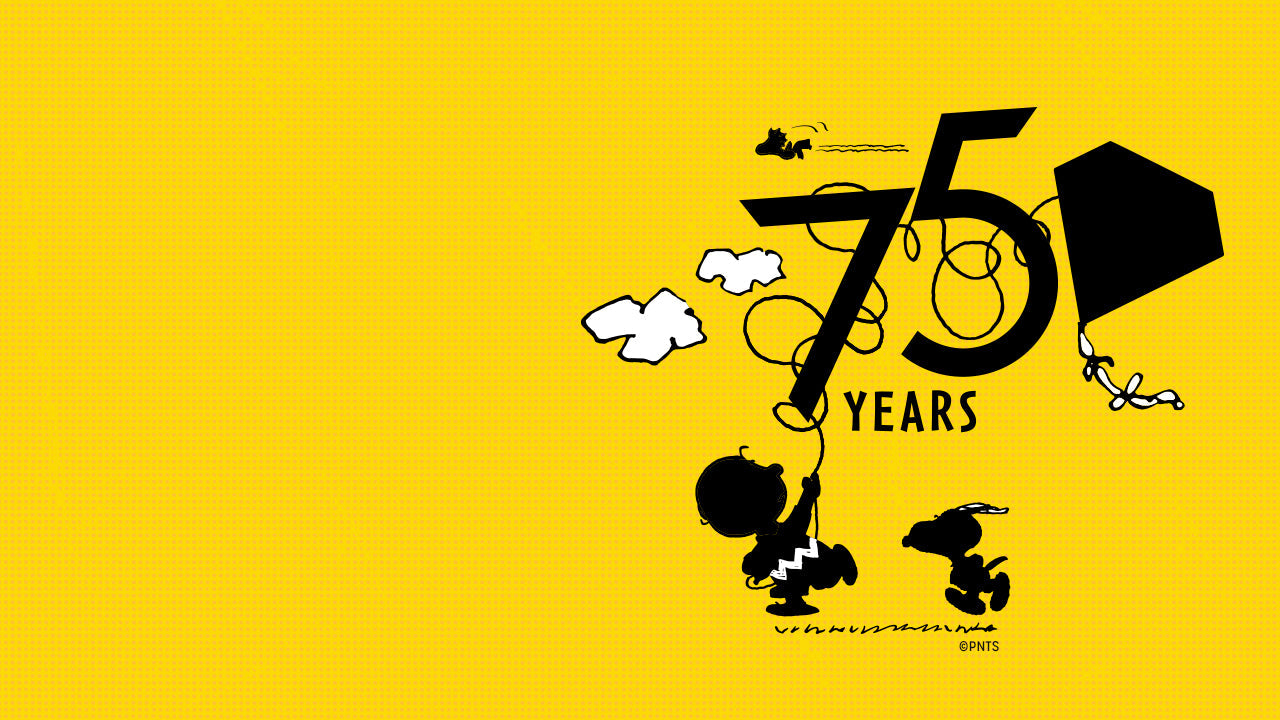 Vibrant yellow Peanuts 75th Anniversary illustration featuring Charlie Brown flying a tangled kite forming the number “75,” while Snoopy and Woodstock look on. A whimsical celebration of 75 years of Peanuts charm.