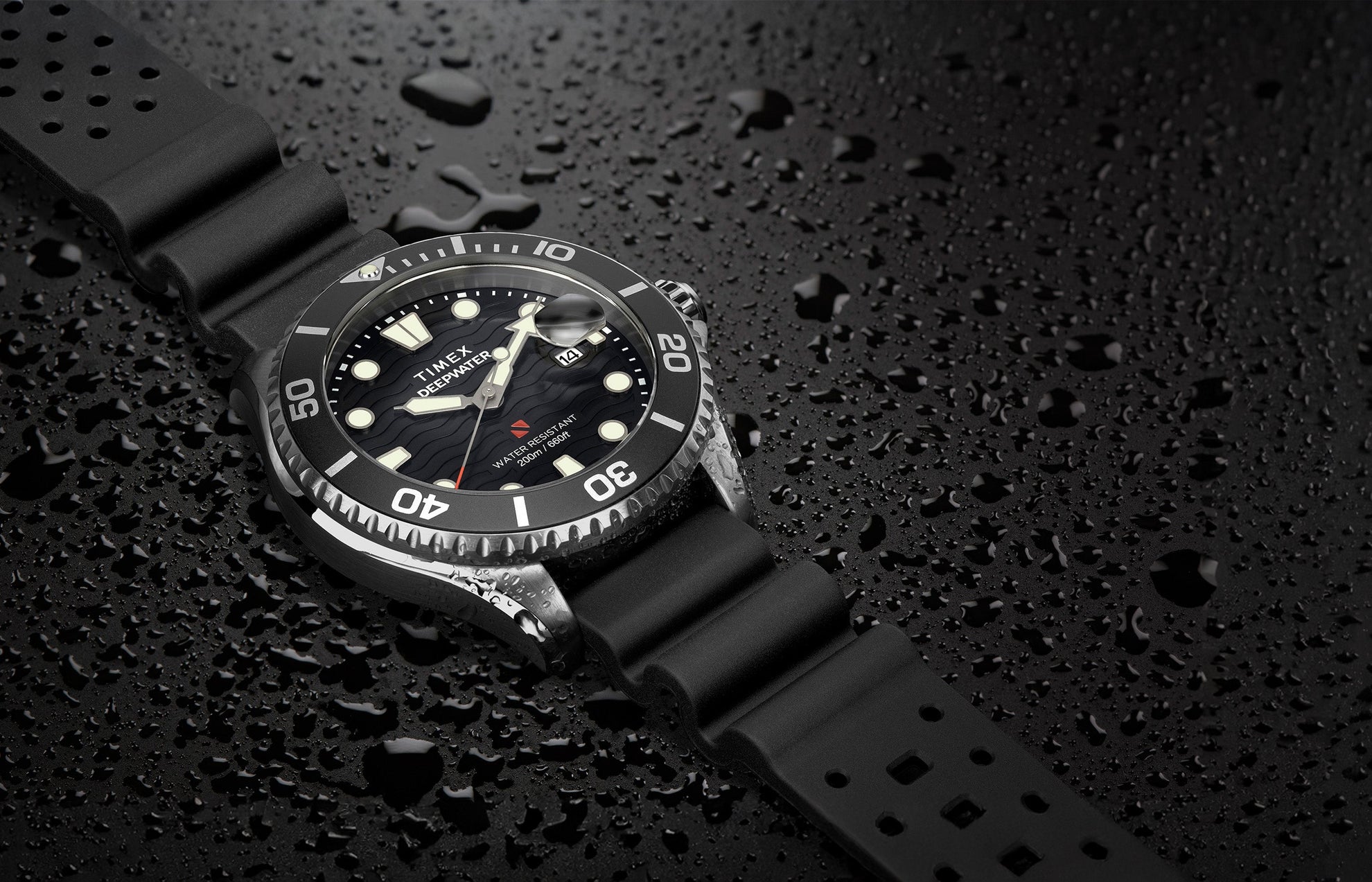 Timex Deepwater Meridian 200 dive watch with black strap and wave-textured black dial resting on a surface covered in water droplets, emphasizing its 200-meter water resistance and rugged construction.