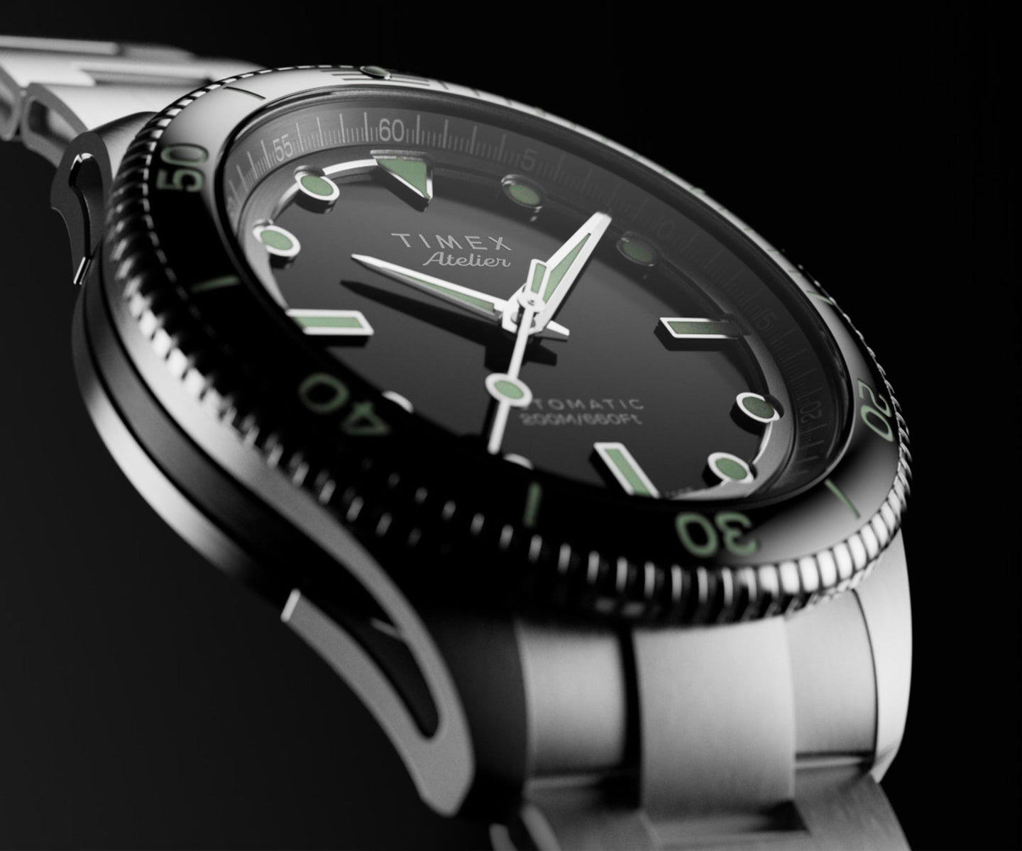 Side perspective of the Timex Atelier automatic dive watch, highlighting its stainless steel case, black rotating bezel, luminous indices, and bracelet.