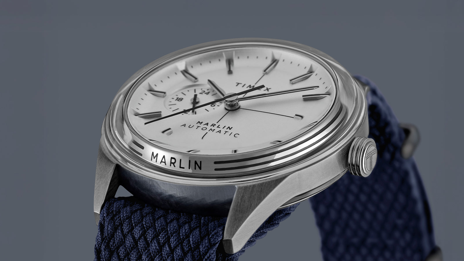 Close-up of Timex Marlin Jet Automatic showcasing domed crystal, silver dial, and 24-hour subdial detail.