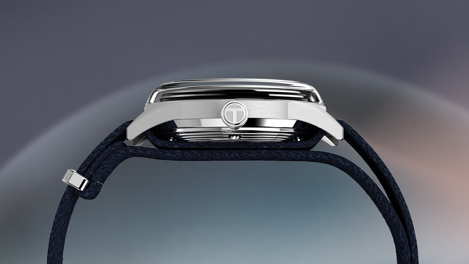 Side profile of Timex Marlin Jet Automatic watch displaying domed crystal and T-engraved crown.