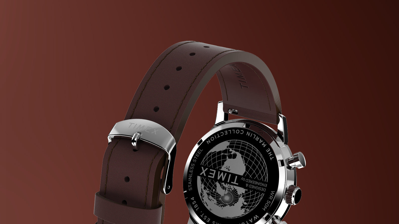 Rear view of Timex Marlin Chronograph Tachymeter showing stainless-steel caseback with globe engraving and brown leather strap with Timex buckle.