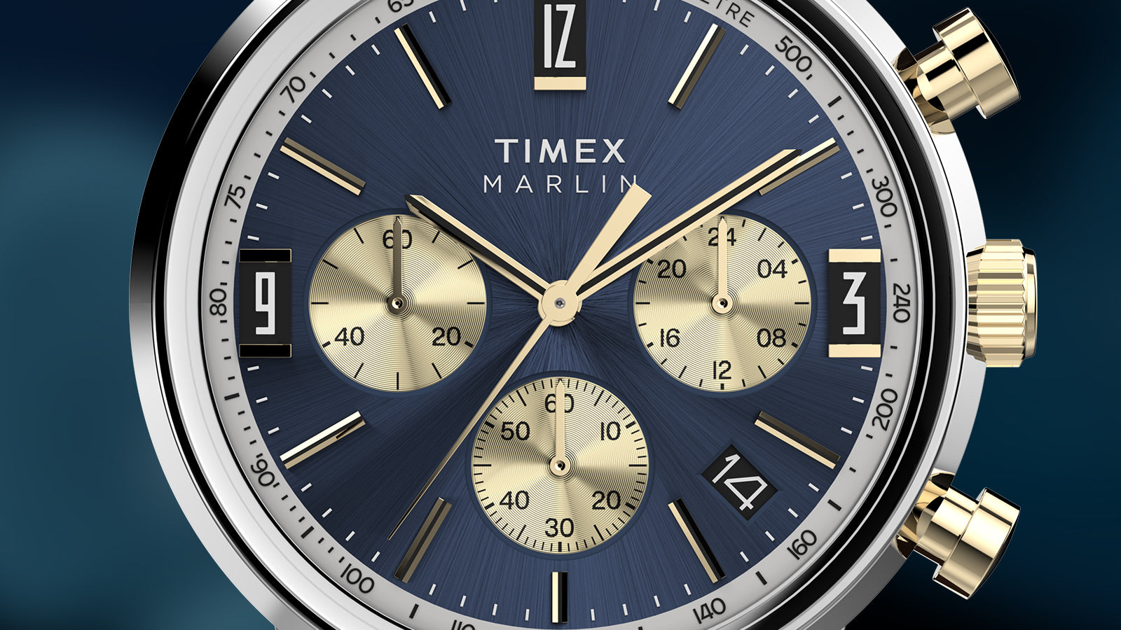 Close-up of Timex Marlin Chronograph Tachymeter with navy blue dial, gold subdials, and tachymeter markings.
