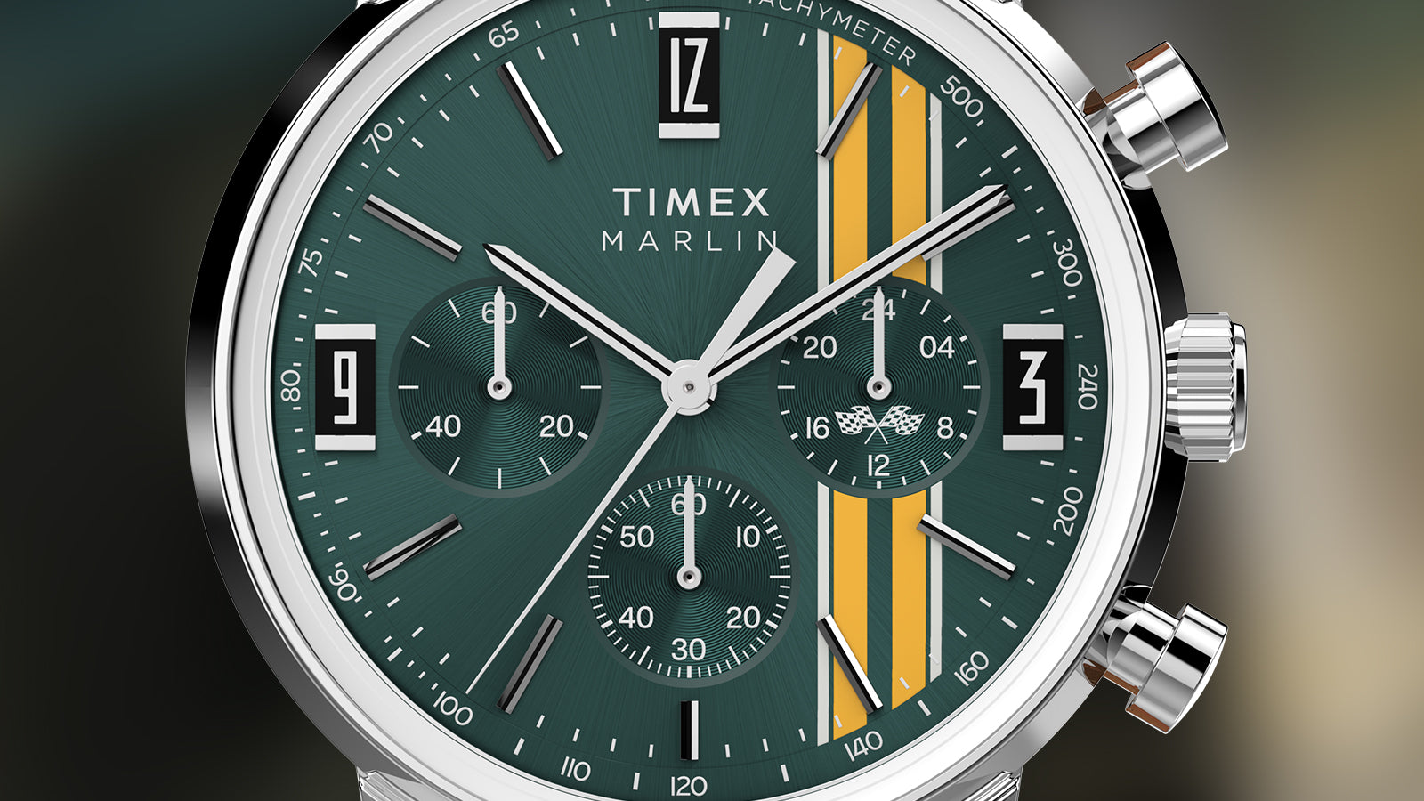 Macro shot of Timex Marlin Chronograph Tachymeter featuring green dial with yellow stripes, silver sub-dials, and tachymeter markings.