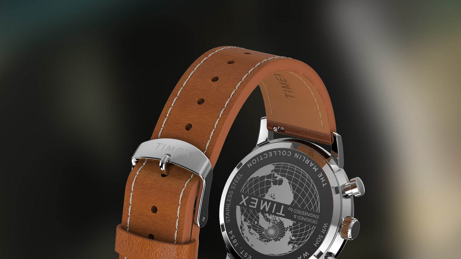 Rear view of Timex Marlin Chronograph Tachymeter showing engraved globe design caseback and stitched brown leather strap.