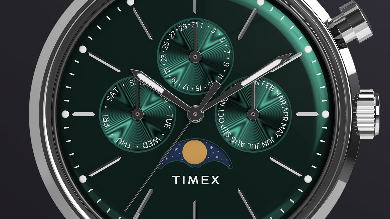 Macro shot of Timex Marlin Moon Phase Multifunction showing detailed green dial with sub-dials for day, date, and month along with moon phase indicator.