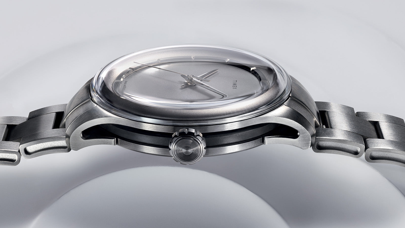 Side profile of the Timex Giorgio Galli S2Ti watch highlighting its domed sapphire crystal, brushed titanium case, and sleek integrated bracelet.