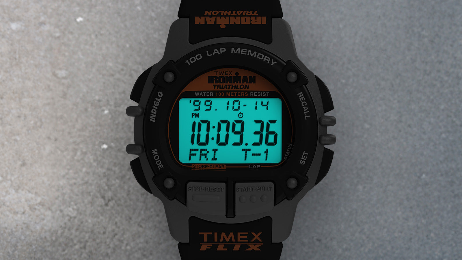 Runner wearing the TIMEX® IRONMAN® Flix 100 watch, tying orange sneakers in a green outdoor setting before a workout.