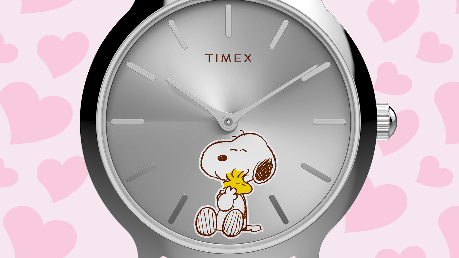 Close-up of the Peanuts® x Timex Transcend Snoopy Hug watch dial featuring Snoopy hugging Woodstock on a silver sunray background.