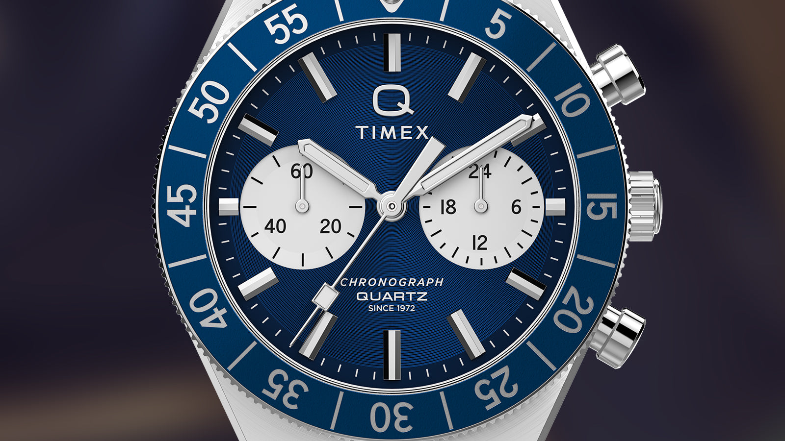 Close-up of the Q Timex Continental Chronograph dial with blue sunray finish, white subdials, and quartz chronograph movement.