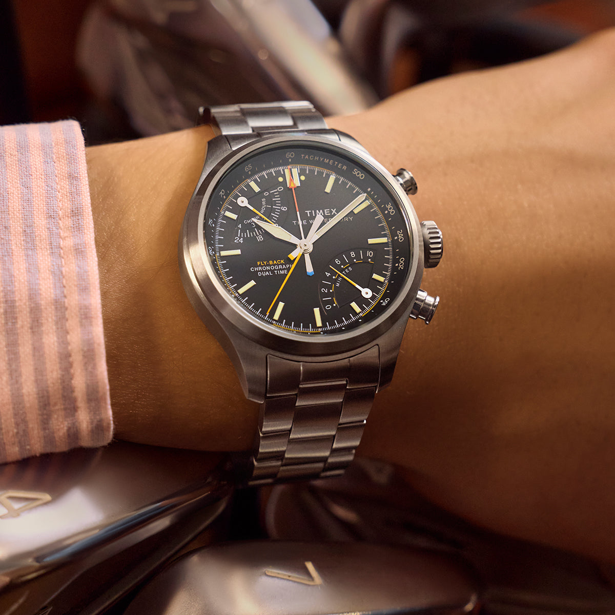 Timex Waterbury Ace Fly-Back Chronograph worn on wrist with stainless steel bracelet and brushed case