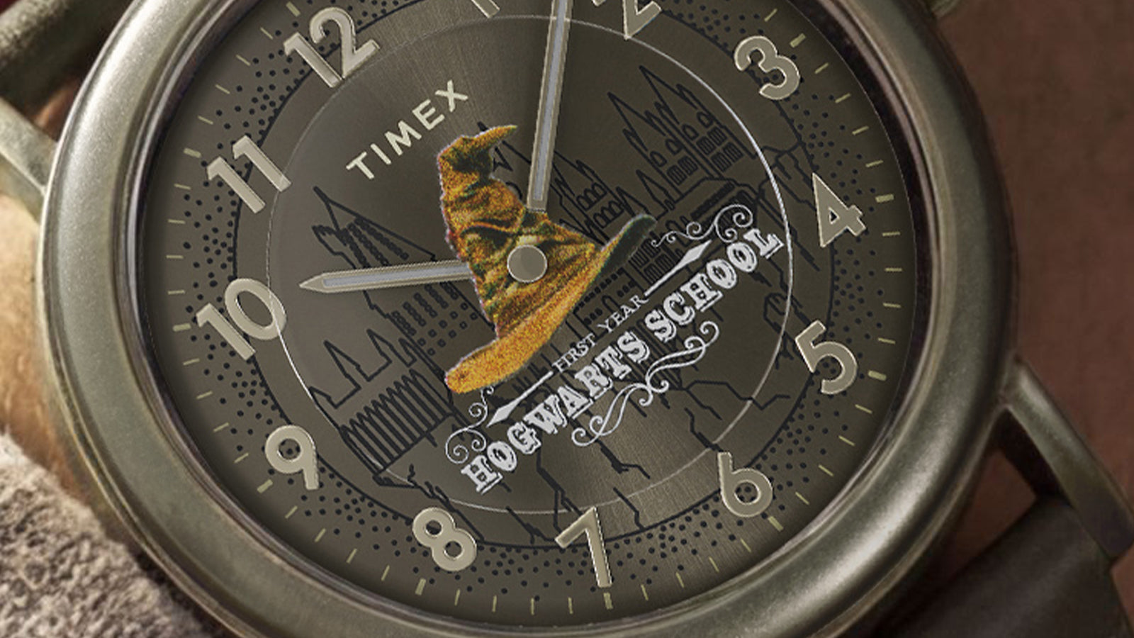 Detailed view of Sorting Hat graphic centered on Harry Potter x Timex Weekender watch dial.