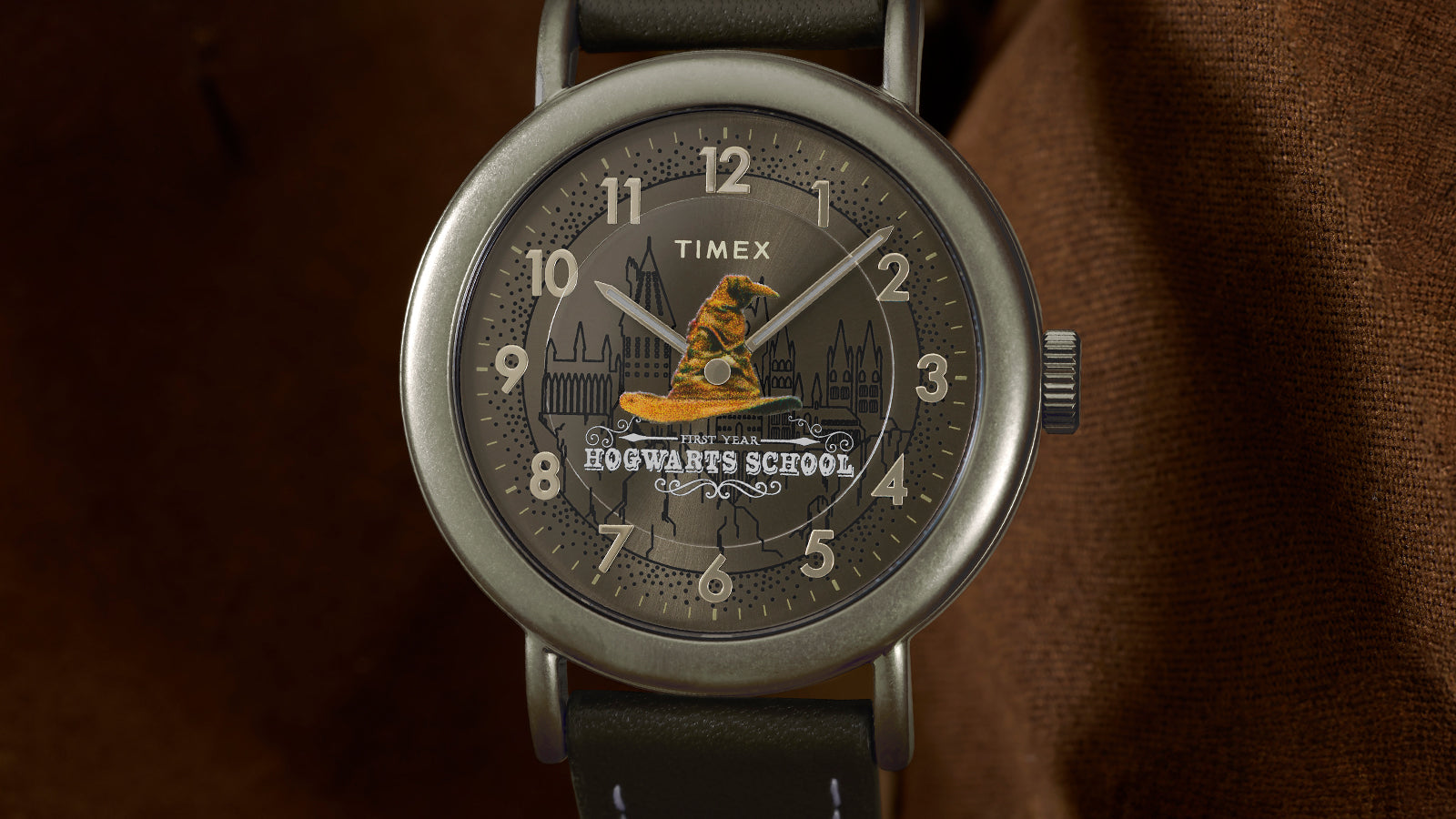 Front view of Harry Potter x Timex Weekender Sorting Hat watch with bronze-tone case and brown leather strap.