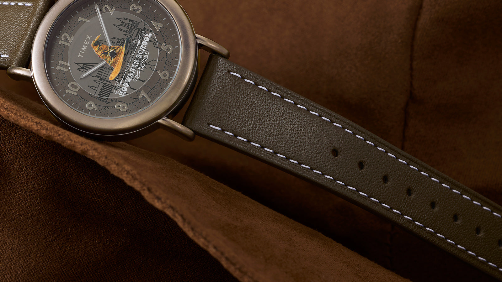 Close-up of brown leather strap with white stitching on Harry Potter x Timex Weekender Sorting Hat watch.