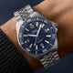 Timex Deepwater Arctic blue dial stainless steel watch worn on wrist with rotating bezel