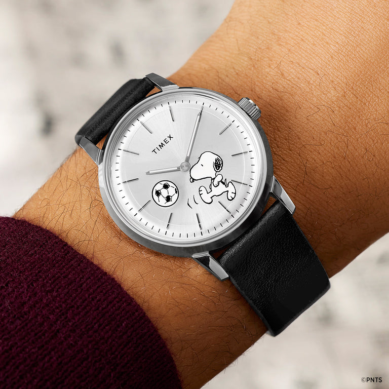 Timex Marlin Automatic x Peanuts Snoopy soccer watch worn on wrist with black leather strap