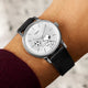 Timex Marlin Automatic x Peanuts Snoopy soccer watch worn on wrist with black leather strap