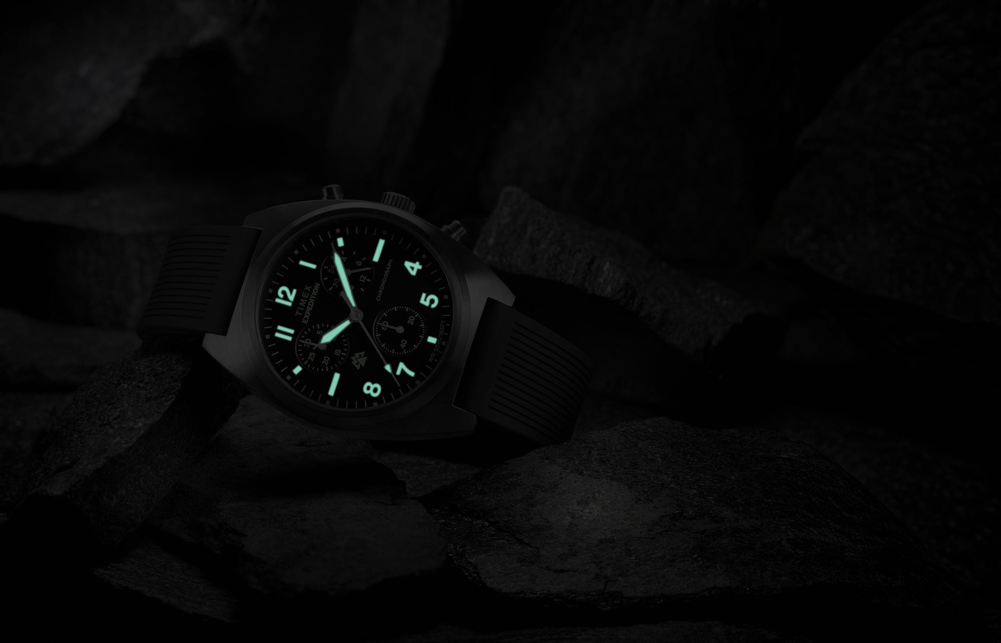 Timex Expedition Capstone Chronograph with glowing lume markers and hands in low light