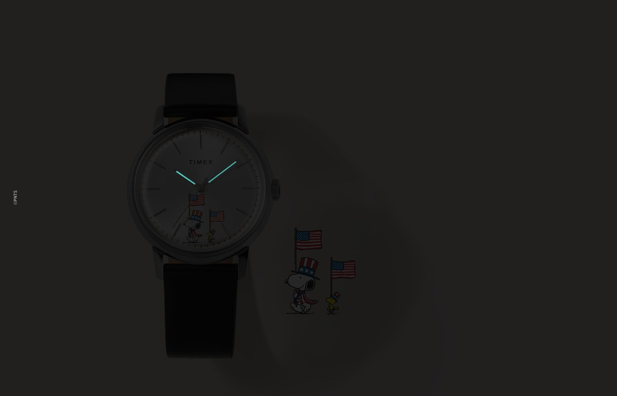 Timex Marlin Automatic Peanuts Americana watch showing glowing hands in low light with Snoopy dial detail