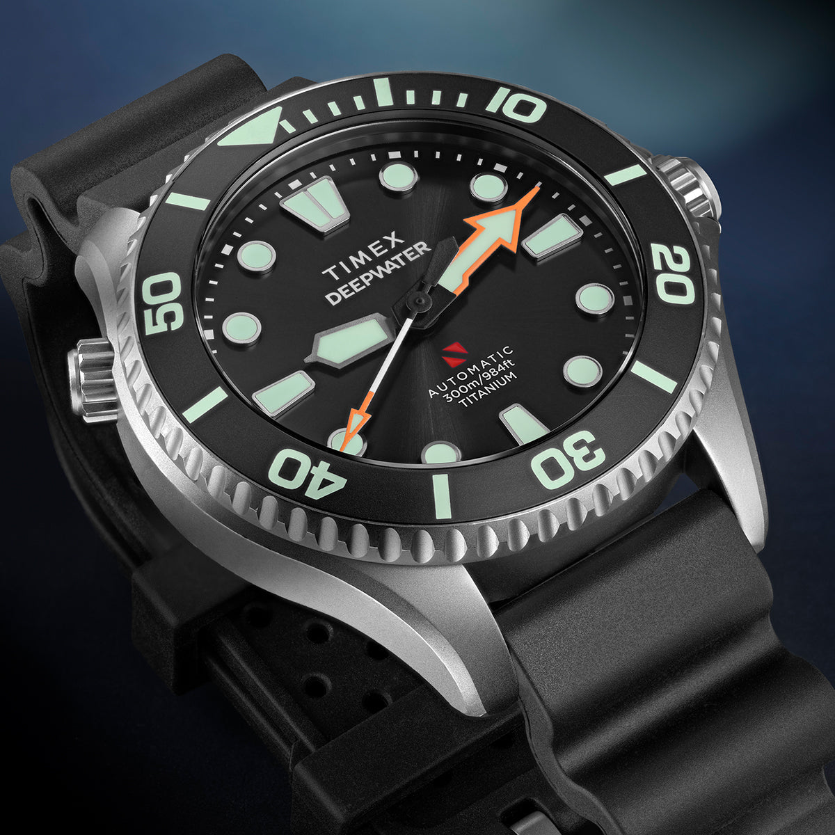Close-up angled view of the Timex Deepwater Meridian 300 Titanium HEV Automatic showcasing luminous markers, titanium case, and black rubber strap.