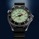 Front view of the Timex Deepwater Meridian 300 Titanium HEV Automatic showcasing its luminous dial, titanium case, and black rubber strap.