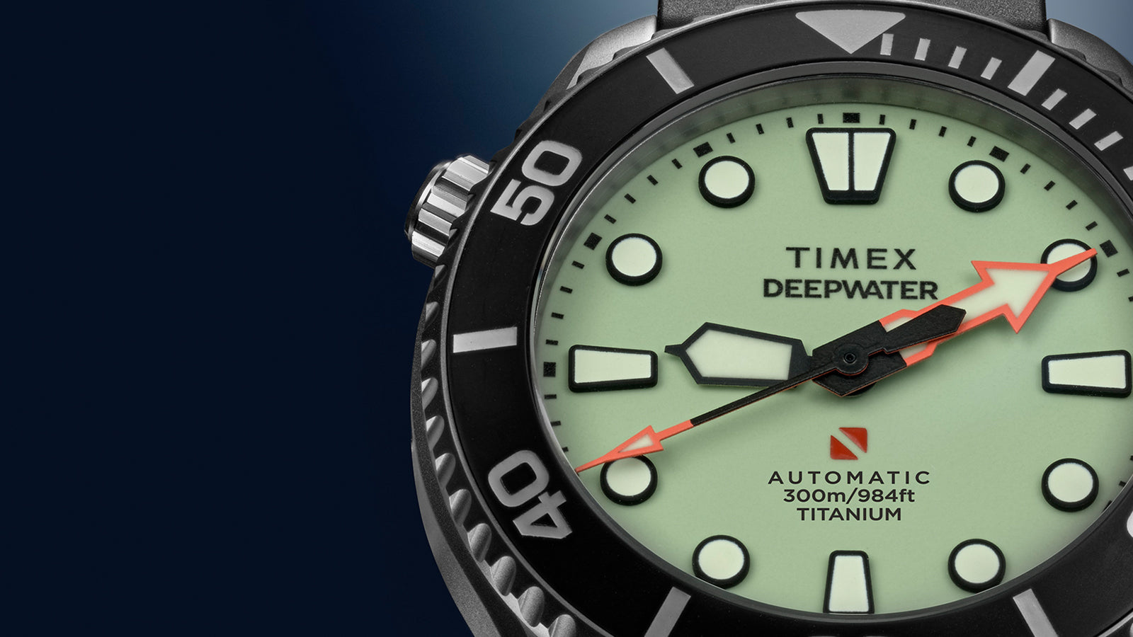 Macro close-up of the Timex Deepwater Meridian 300 Titanium HEV Automatic highlighting the full-lume dial, titanium construction, and diver-style bezel.