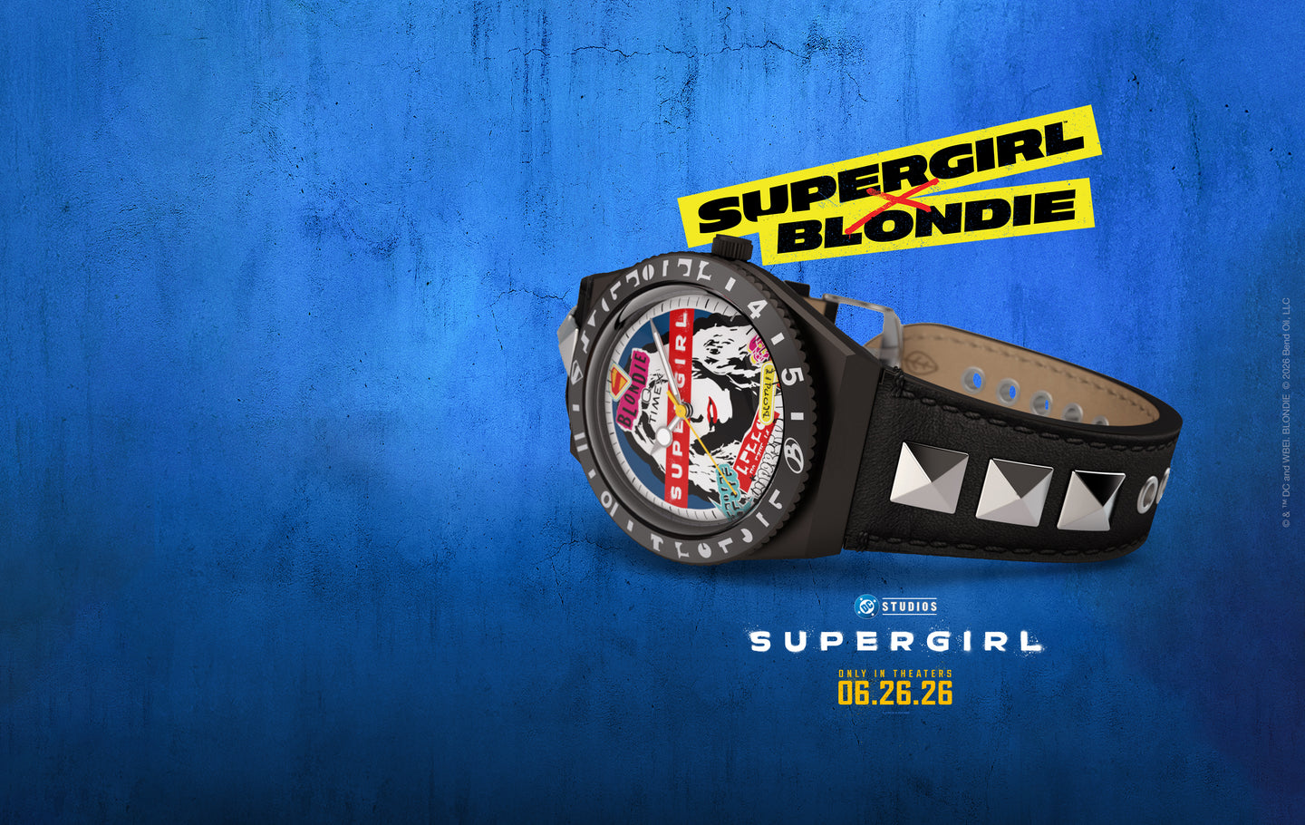 Timex x Supergirl Blondie watch with studded black leather strap and graphic Blondie-inspired dial, shown on a blue background with Supergirl movie branding.