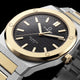 Close-up of the Timex Q Marbella black textured dial with a brushed gold-tone bezel and two-tone stainless steel bracelet.