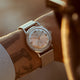 Close-up of the Todd Snyder x Timex Marlin® Mesh watch with a silver sunray dial and stainless steel mesh bracelet worn on the wrist.