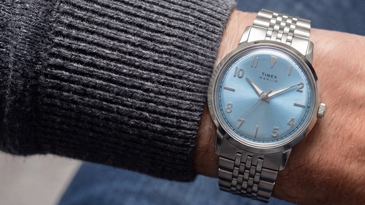 Close-up of the Timex Marlin Quartz with an ice blue dial and stainless steel bracelet worn on the wrist.