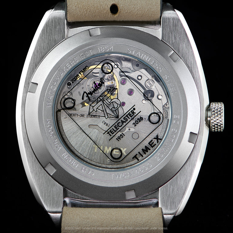 Close-up of the transparent caseback revealing the automatic movement and Fender Telecaster artwork.