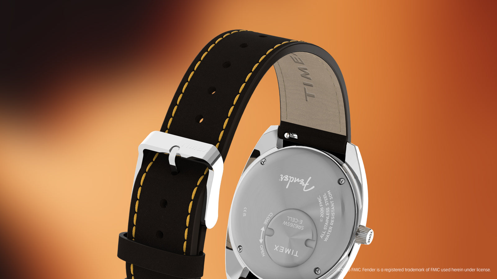Rear view of the Fender x Timex watch featuring a stainless-steel caseback and brown leather strap with yellow stitching.