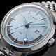 Detailed angled view of the Marlin® Quartz GMT dial, blue hands, GMT hand, and date window.