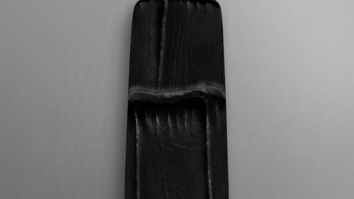 Close-up of the Cavatina® Mini’s black croc-embossed leather strap.