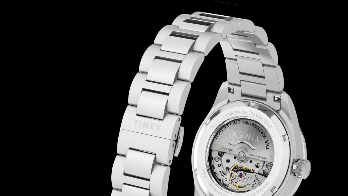 Rear view of the Waterbury Heritage Automatic, highlighting its stainless-steel bracelet and exhibition case back.