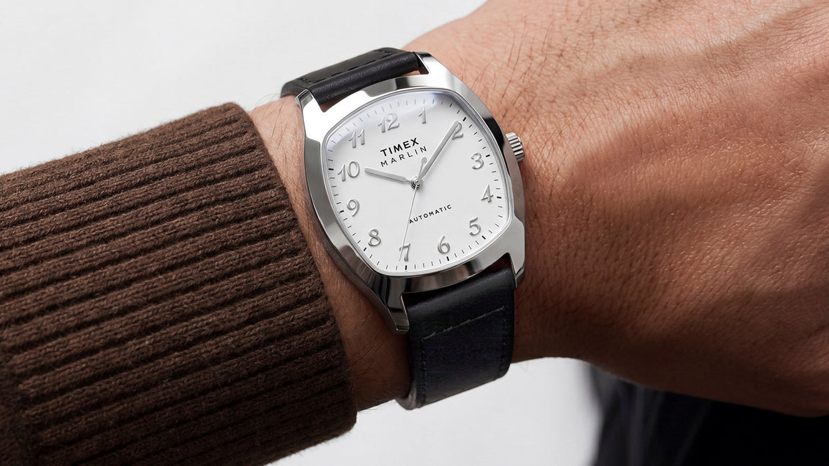 TW2Y84300 Close-up of the Marlin® Chatham Automatic watch on a wrist, showing its polished silver-tone case and white dial.